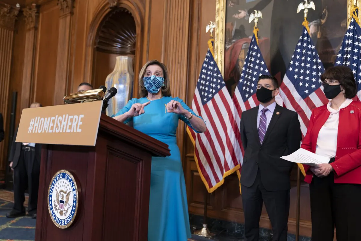 House Speaker Nancy Pelosi (D-Calif.) speaks during a press briefing with Rep. Raul Ruiz (D-Calif.), center, chairman of the House Hispanic Caucus, and Rep. Lucille Roybal-Allard (D-Calif.), to discuss the vote on the American Dream and Promise Act, in Washington on March 18, 2021. (J. Scott Applewhite/AP Photo)