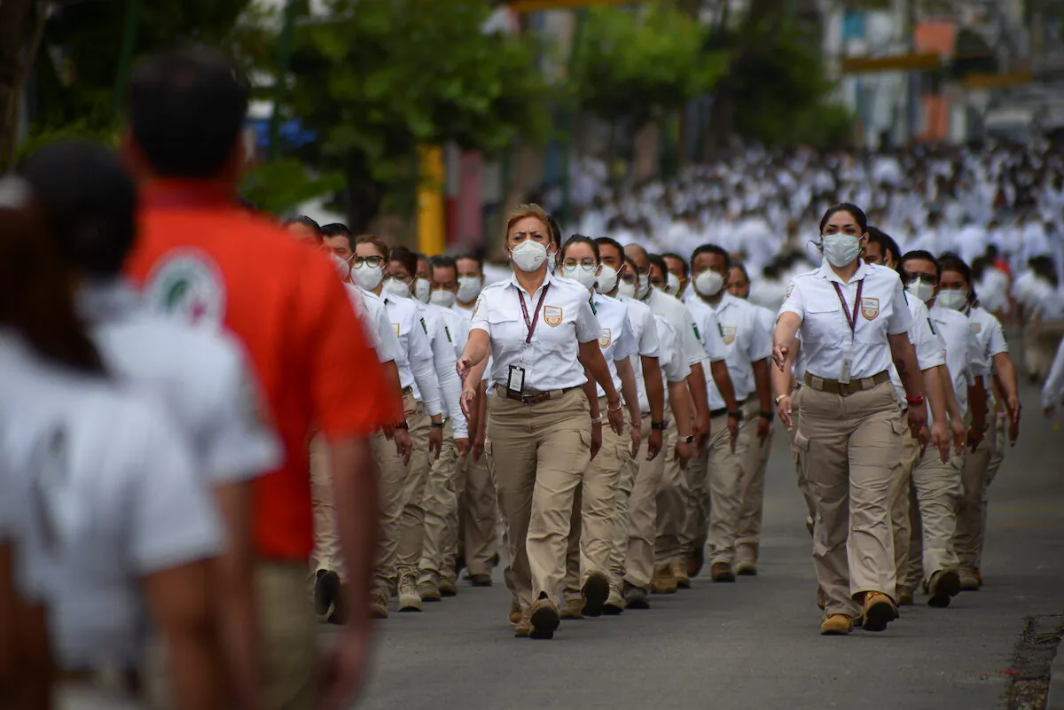 Agents of the National Migration Institute (INM) march during the announcement of the new measures by the Mexican government to deter illegal crossings at the southern border with Guatemala, in Tuxtla Gutierrez, Mexico on March 19, 2021. (Jacob Garcia/REUTERS)