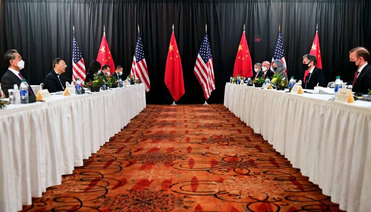 U.S. Secretary of State Antony Blinken (2nd R), joined by National Security Advisor Jake Sullivan (R), speaks while facing Yang Jiechi (2nd L), director of the Central Foreign Affairs Commission Office, and Wang Yi (L), China's State Councilor and Foreign Minister, at the opening session of U.S.-China talks at the Captain Cook Hotel in Anchorage, Alaska, on March 18, 2021. (Frederic J. Brown/Pool via Reuters)