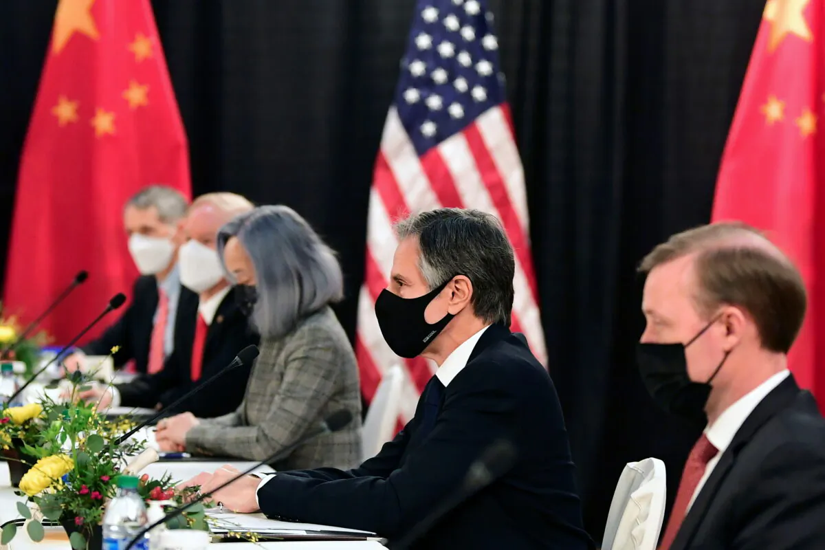 The U.S. delegation led by Secretary of State Antony Blinken (C) and flanked by National Security Advisor Jake Sullivan (R), face their Chinese counterparts at the opening session of U.S.-China talks at the Captain Cook Hotel in Anchorage, Alaska, on March 18, 2021.  (Frederic J. Brown/Pool via Reuters)