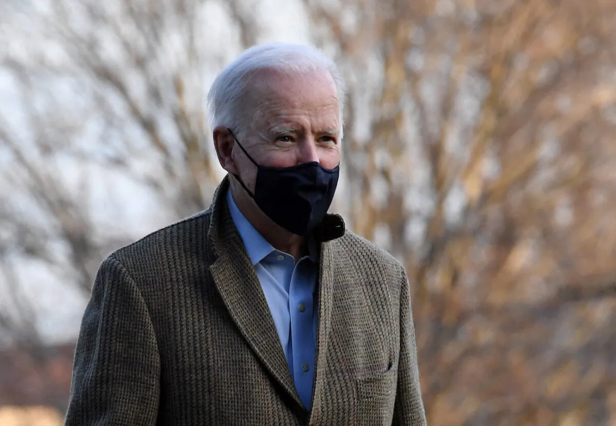 President Joe Biden walks across the South Lawn upon returning to the White House in Washington on March 14, 2021. (Olivier Douliery/AFP via Getty Images)