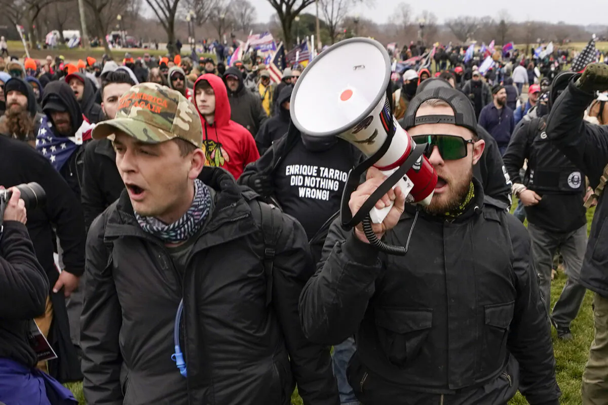 Proud Boys members Zachary Rehl (L) and Ethan Nordean walk toward the U.S. Capitol in Washington on Jan. 6, 2021. (Carolyn Kaster/AP Photo)