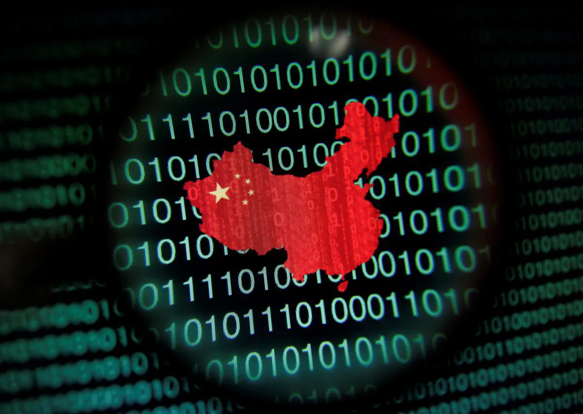 A map of China is seen through a magnifying glass on a computer screen showing binary digits in this file photo. (Edgar Su/Reuters)