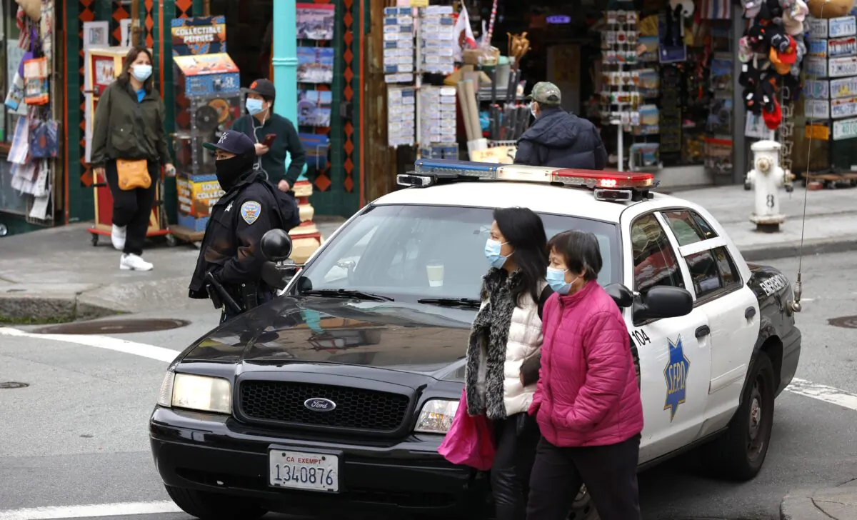 A police officer on Grant Avenue, Chinatown, in San Francisco on March 17, 2021. (Justin Sullivan/Getty Images)
