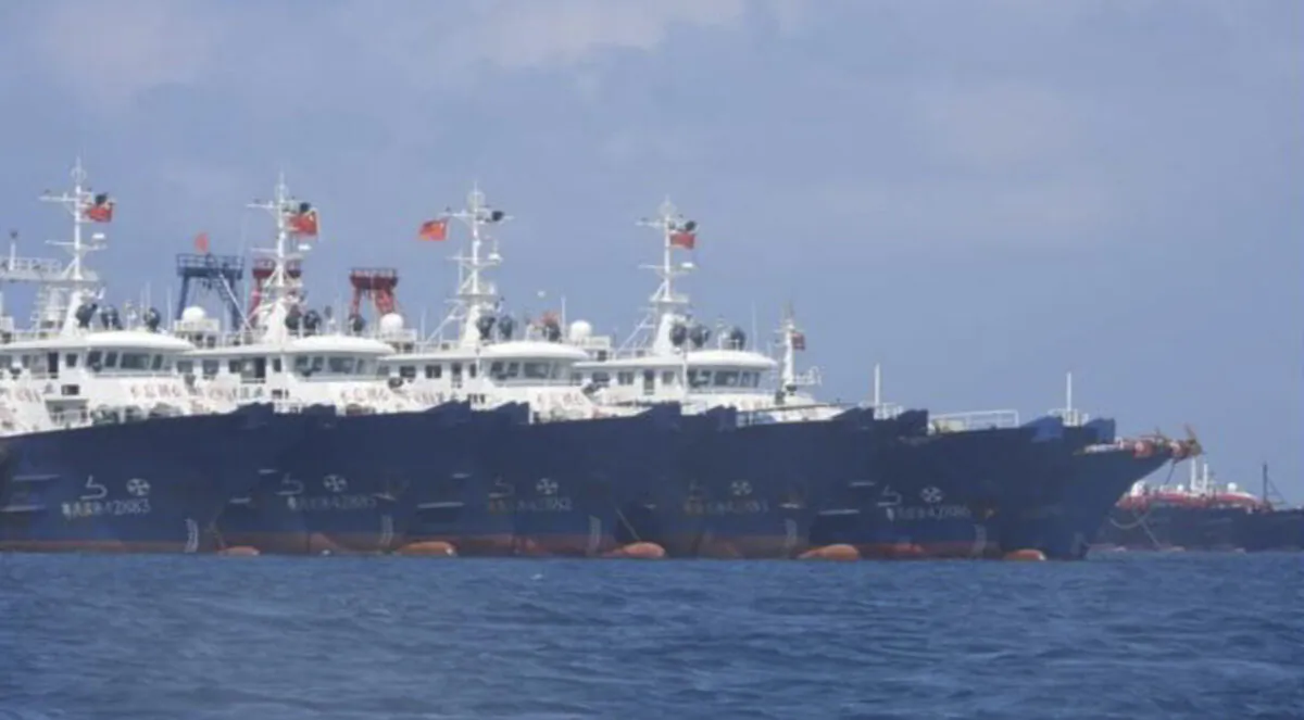 Some of the 220 Chinese vessels are seen moored at Whitsun Reef, South China Sea on March 7, 2021. (Philippine Coast Guard/National Task Force-West Philippine Sea via AP)
