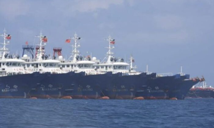 Some of the 220 Chinese vessels are seen moored at Whitsun Reef, South China Sea on March 7, 2021. (Philippine Coast Guard/National Task Force-West Philippine Sea via AP)