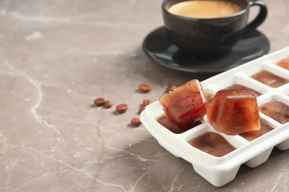 Freeze leftover brewed coffee in ice cube trays to make blended coffee drinks or iced coffee. (New Africa/Shutterstock)