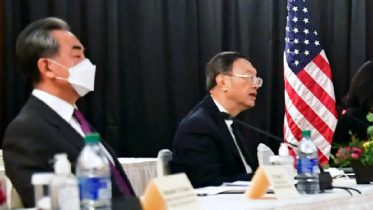 Yang Jiechi (R), director of the Central Foreign Affairs Commission Office, and Wang Yi (L), China's State Councilor and Foreign Minister, at the opening session of U.S.-China talks at the Captain Cook Hotel in Anchorage, Alaska, on March 18, 2021. (Frederic J. Brown/Pool via Reuters)