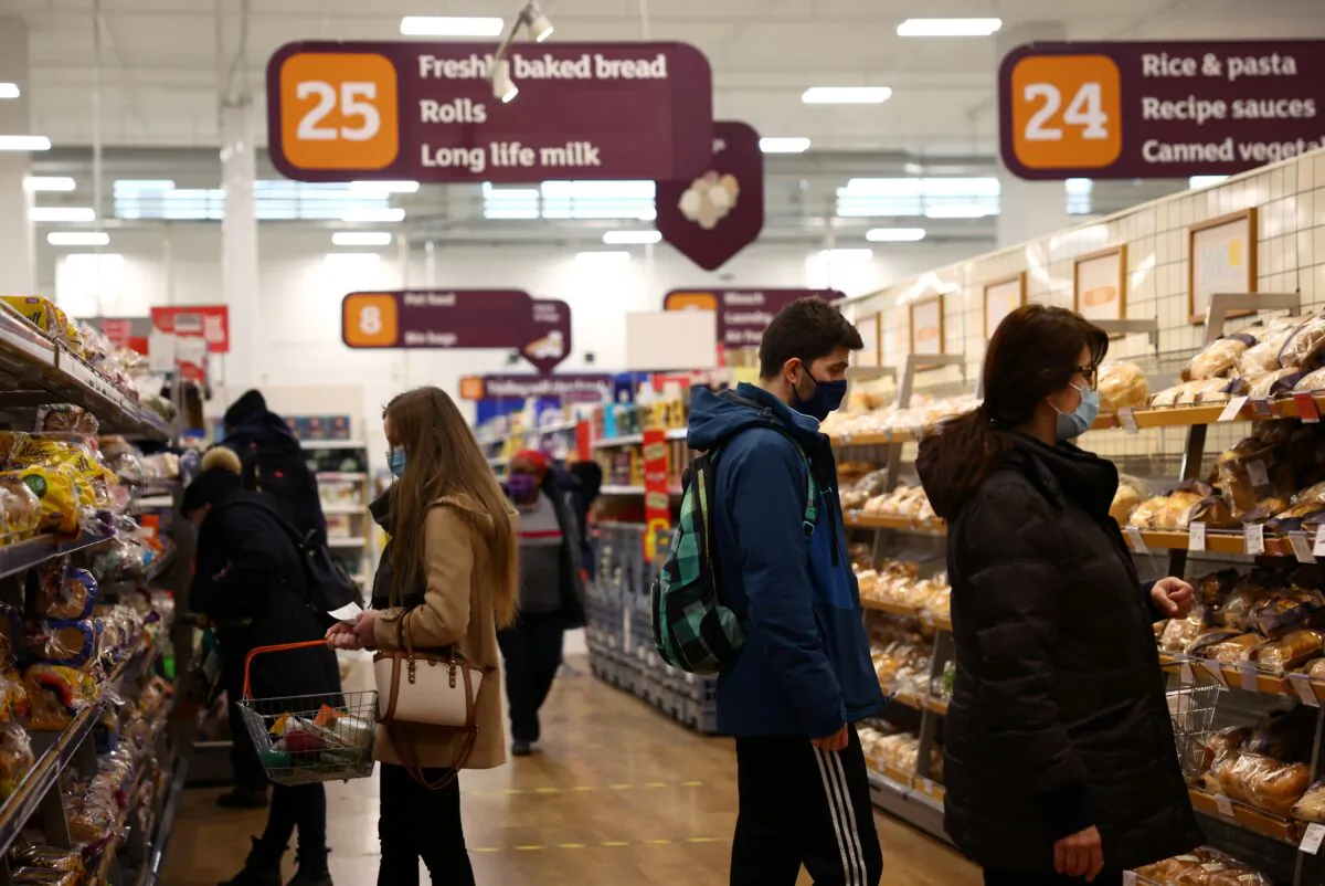 Shoppers look at bread in a Sainsbury's supermarket, amid the CCP virus outbreak, in London on Jan. 12, 2021. (Henry Nicholls/Reuters)