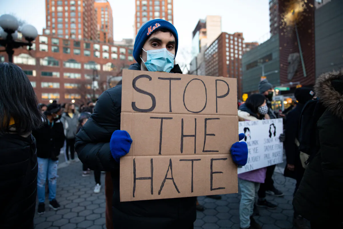 People attend a vigil for victims of anti-Asian hate crimes at Union Square in New York on March 19, 2021. (Chung I Ho/The Epoch Times)