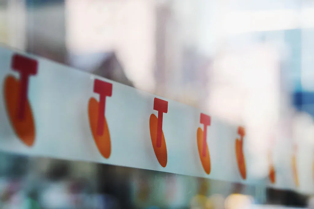 Telstra logos are seen outside the Telstra Melbourne headquarters on June 14, 2017 in Melbourne, Australia. (Photo by Michael Dodge/Getty Images)