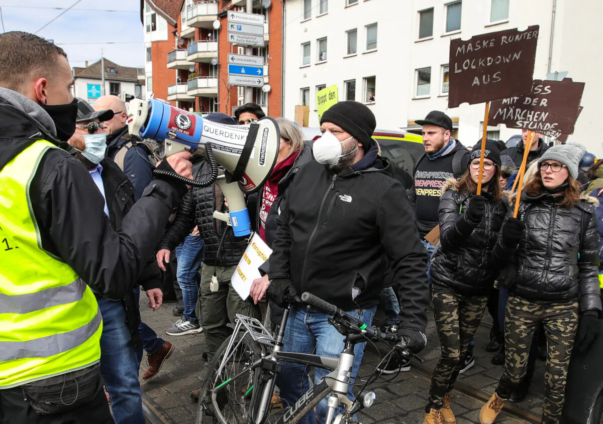 Protesters gather for a demonstration to demand an end to the restrictive CCP virus measures in Kassel, central Germany, on March 20, 2021. (Armando Babani/AFP via Getty Images)