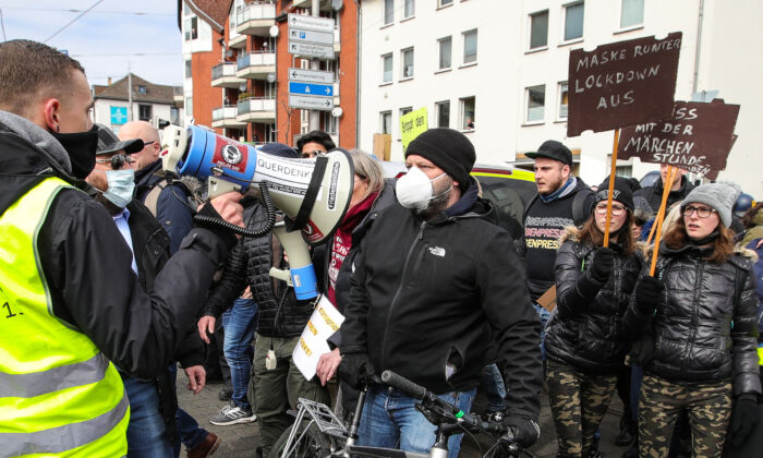 Protesters gather for a demonstration to demand an end to the restrictive CCP virus measures in Kassel, central Germany, on March 20, 2021. (Armando Babani/AFP via Getty Images)