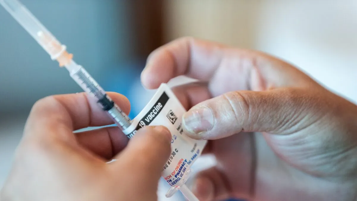 Nurses prepare Pfizer-BioNTech COVID-19 vaccines at the Austin Hospital in Melbourne, Australia on March 17, 2021. (Asanka Ratnayake/Getty Images)
