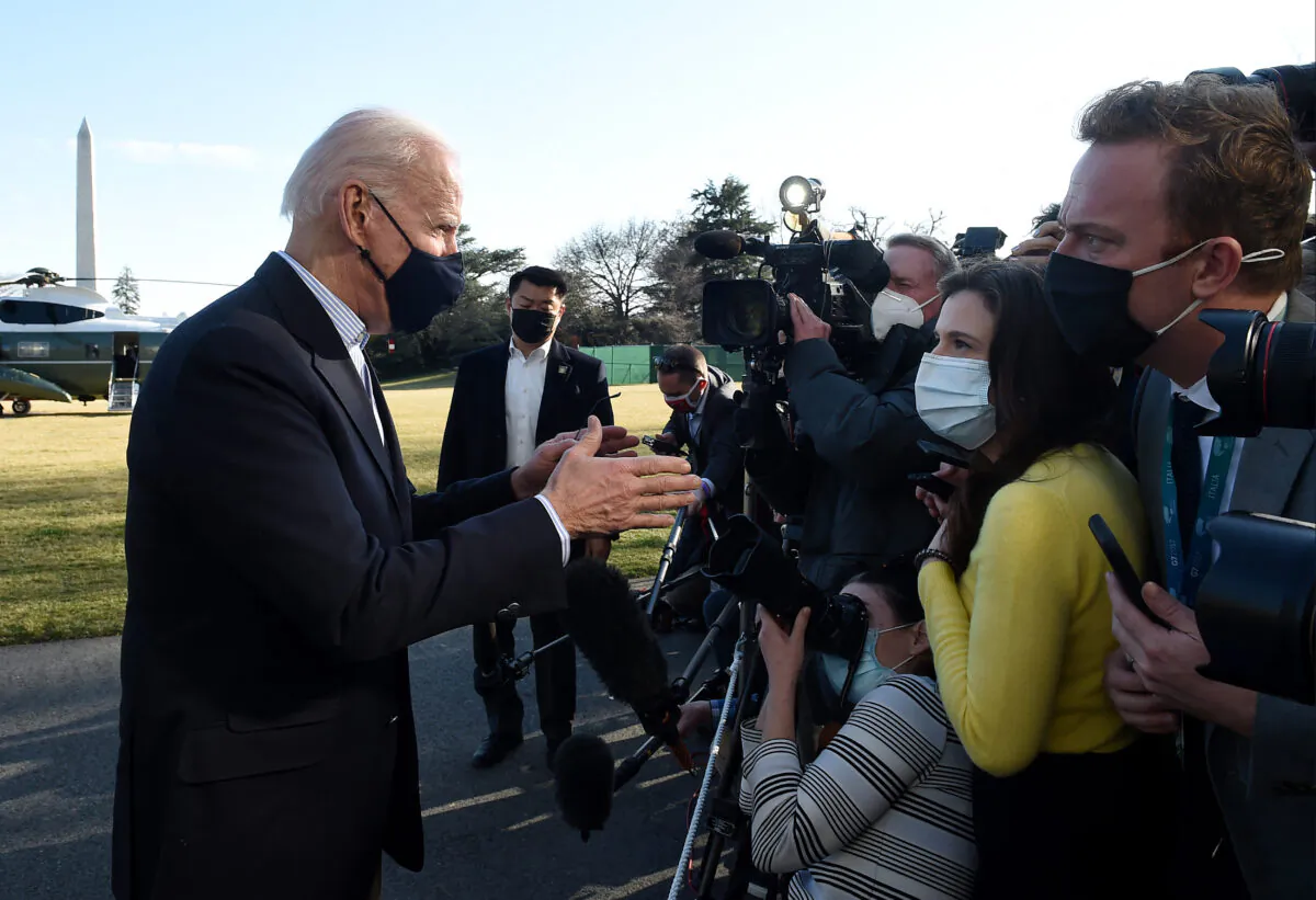 U.S. President Joe Biden talks briefly with reporters upon his return from Camp David, Maryland, to the White House in Washington, D.C., on March 21, 2021. (OLIVIER DOULIERY/AFP via Getty Images)
