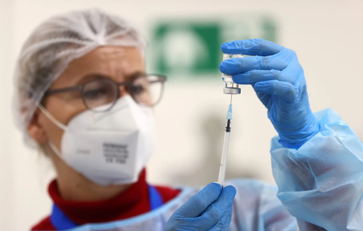 An AstraZeneca COVID-19 vaccine is prepared at a local vaccination center as the spread of COVID-19 continues in Hagen, Germany, on March 19, 2021. (Kai Pfaffenbach/Reuters)