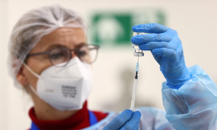 An AstraZeneca COVID-19 vaccine is prepared at the local vaccination centre as the spread of the coronavirus disease (COVID-19) continues in Hagen, Germany, on March 19, 2021.  (Kai Pfaffenbach/Reuters)