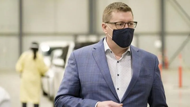 Premier Scott Moe during a tour of the COVID-19 mass immunization clinic and drive-thru immunization space at the International Trade Centre in Regina on Feb. 18, 2021. (Michael Bell / The Canadian Press)