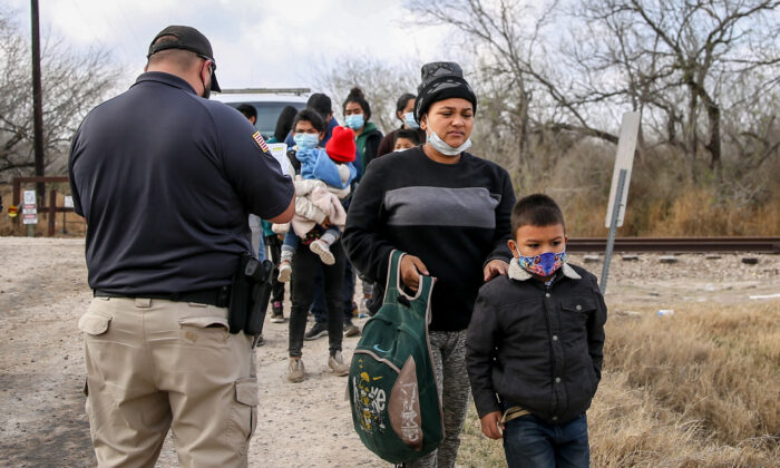 U.S. Border Patrol agents apprehend about two dozen illegal immigrants in Penitas, Texas, on March 11, 2021. (Charlotte Cuthbertson/The Epoch Times)