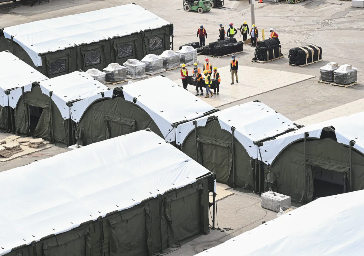 Construction workers set up a make-shift hospital at Sunnybrook Hospital in Toronto on March 11, 2021. (The Canadian Press/Nathan Denette)