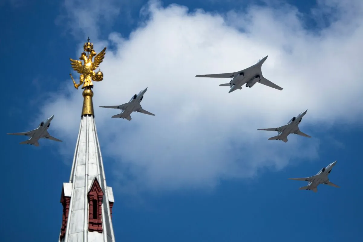 A Tupolev Tu-160 and Tu-22M3 military aircrafts fly over Red Square in Moscow, in a file photo. (Pavel Golovkin/AFP via Getty Images)