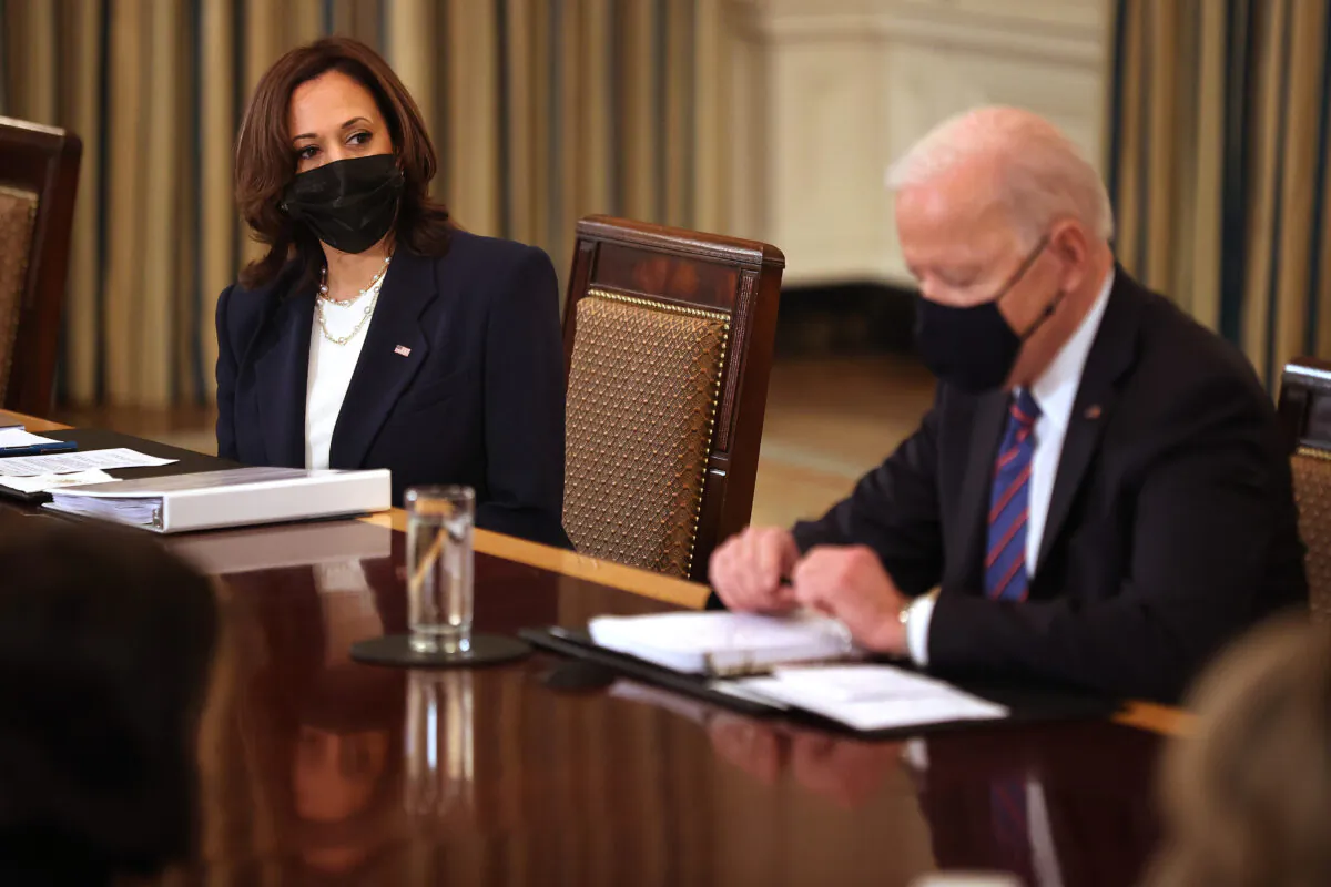 Vice President Kamala Harris (L) and President Joe Biden meet with cabinet members and immigration advisers in the State Dining Room in Washington on March 24, 2021. (Chip Somodevilla/Getty Images)