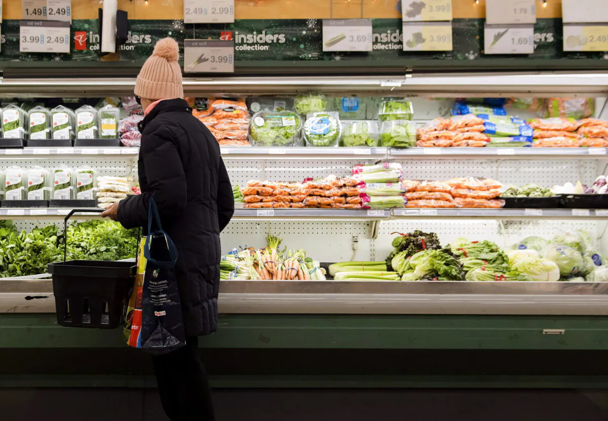 A woman shops for produce at a grocery store in Toronto, in a file photo. (Nathan Denette/The Canadian Press)