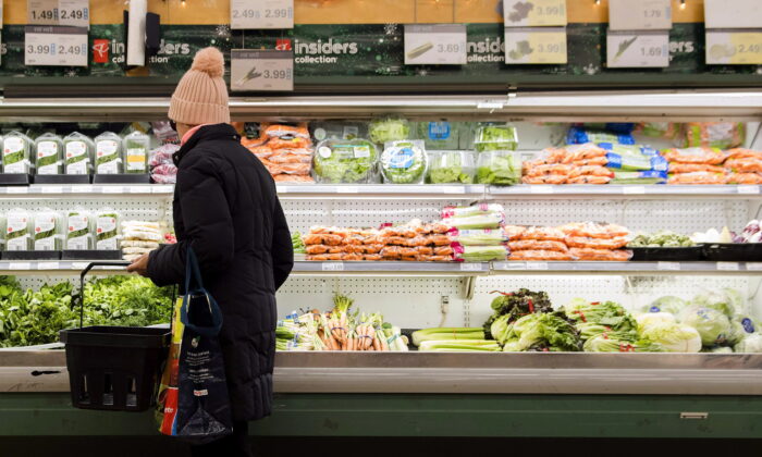 A woman shops for produce in a grocery store in Toronto, Canada, in a file photo. (Nathan Denette/The Canadian Press)