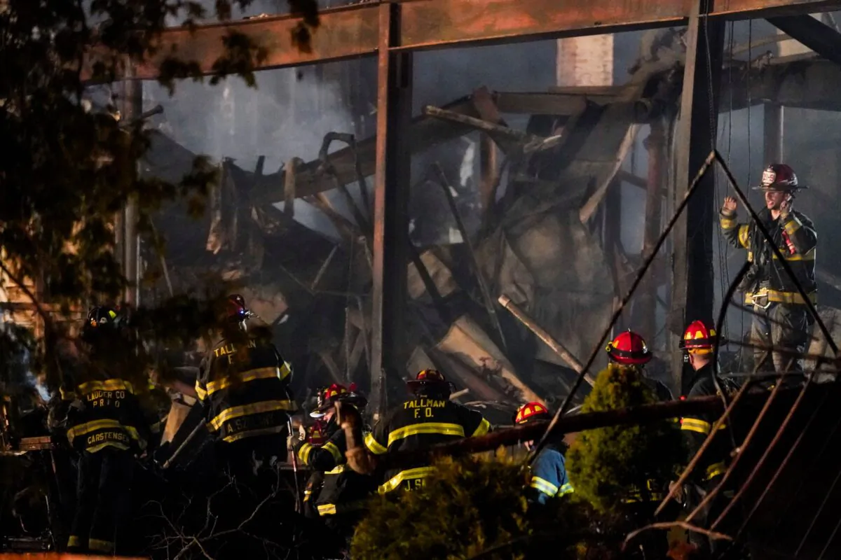 Firefighters work at the scene of a fire that burned down the Evergreen Court Home for Adults in Spring Valley, N.Y., on March 23, 2021. (Frank Franklin II/AP Photo)