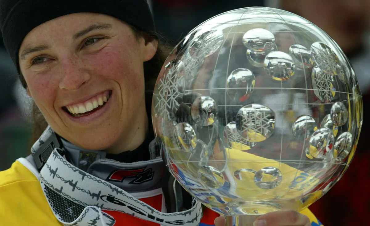 France's Julie Pomagalski smiles as she holds her World Cup trophy at the Alpine skiing World Cup finals in Bardonecchia, Italy, on March 14, 2004. Pomagalski was crowned 2004 World Cup Snowboard winner. (Kieran Doherty/Reuters File Photo