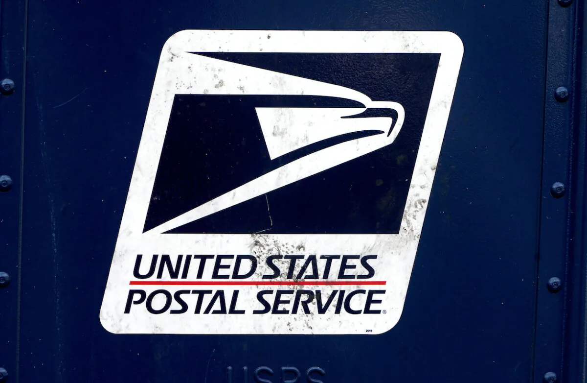 A U.S. Postal Service (USPS) logo is pictured on a mail box in the Manhattan borough of New York City on Aug. 21, 2020. (Carlo Allegri/Reuters)