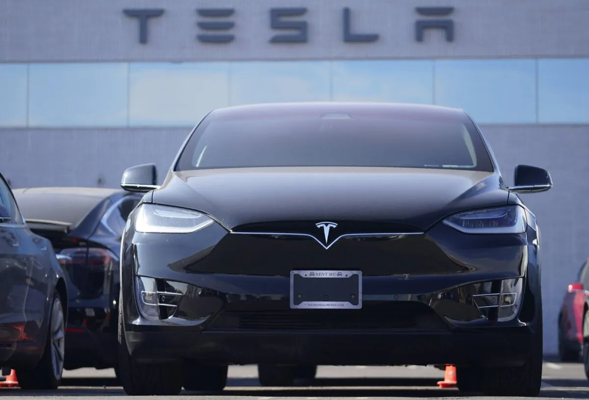 An unsold 2021 Model X sports-utility vehicle sits at a Tesla dealership in Littleton, Colo., on Jan. 24, 2021. (David Zalubowski/AP Photo)