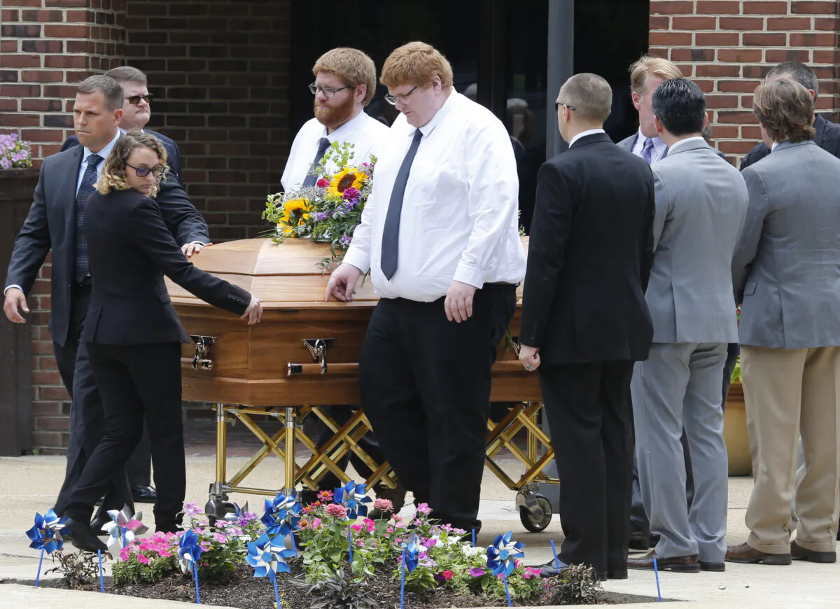 The casket of Virginia Beach shooting victim Katherine Nixon is brought to a hearse after a funeral service at St. Gregory The Great Catholic Church in Virginia Beach, Va. on June 6, 2019. (Steve Helber/AP Photo)