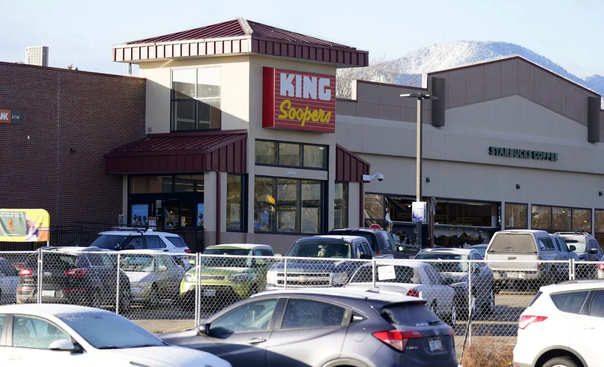 A makeshift fence stands around the parking lot outside a King Soopers grocery store where a mass shooting took place a day earlier in Boulder, Colo., on March 23, 2021. (David Zalubowski/AP Photo)
