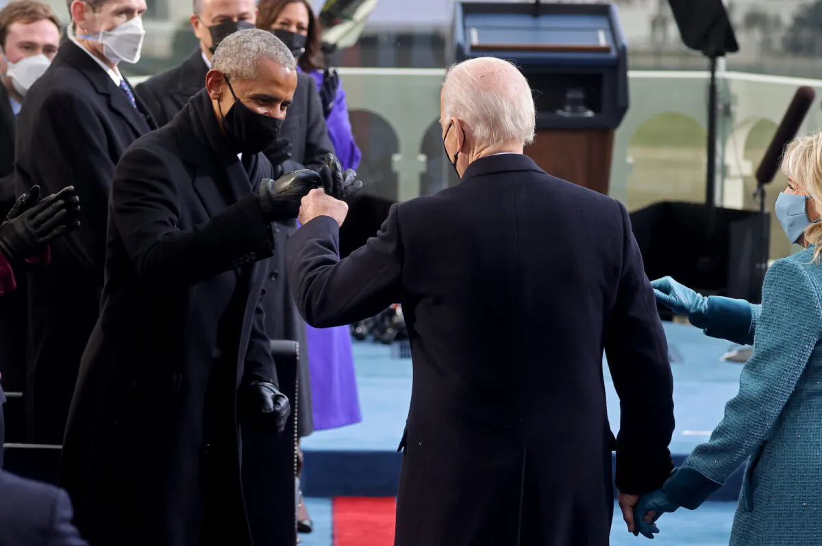 President-elect Joe Biden bumps fists with former President Barack Obama during Biden's inauguration as the 46th President of the United States on the West Front of the U.S. Capitol in Washington on Jan. 20, 2021. (Jonathan Ernst/Pool/Reuters)