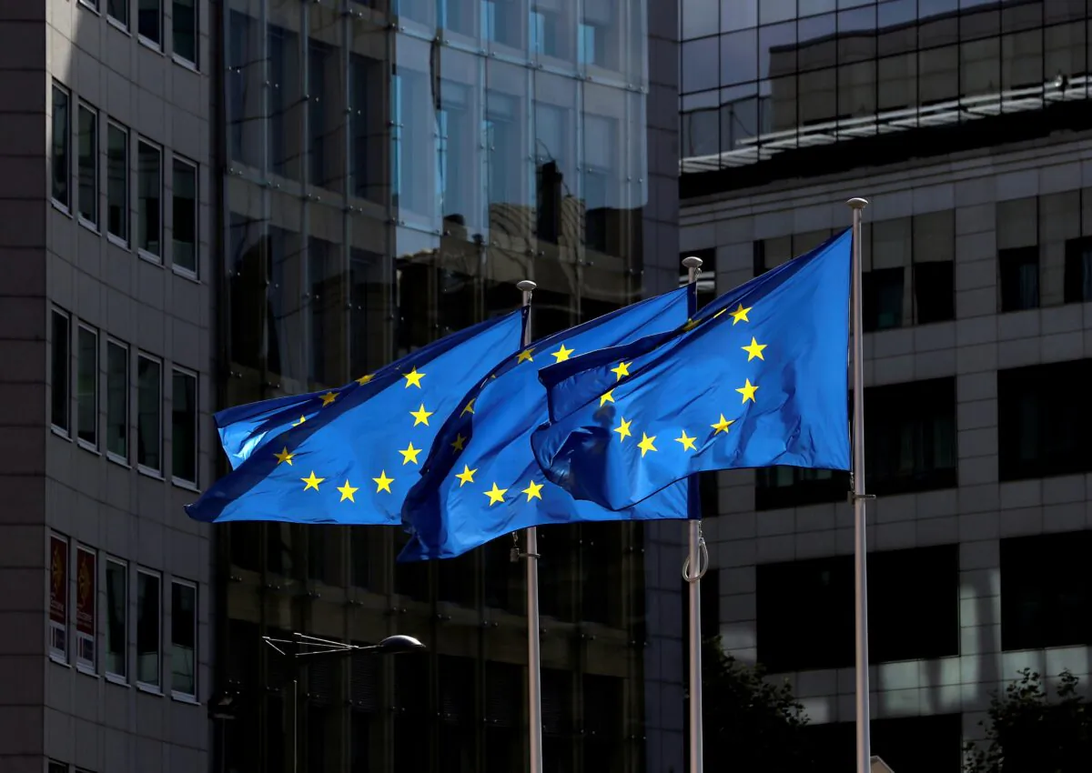 European Union flags flutter outside the European Commission headquarters in Brussels, Belgium, on Aug. 21, 2020. (Yves Herman/Reuters)