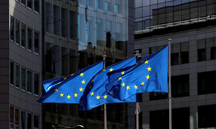 European Union flags flutter outside the European Commission headquarters in Brussels, Belgium, on Aug. 21, 2020. (Yves Herman/Reuters)