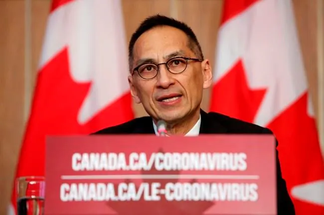 Dr. Howard Njoo, Deputy Chief Public Health Officer at Public Health Agency of Canada, speaks during a COVID-19 press conference at the Sir John A. Macdonald Building in Ottawa on Dec. 23, 2020. (David Kawai/The Canadian Press)