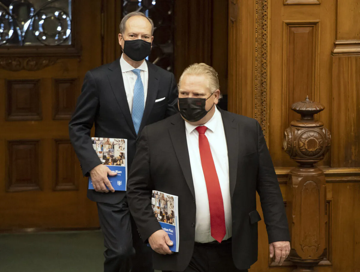Ontario Finance Minister Peter Bethlenfalvy arrives in the Ontario Legislature with Premier Doug Ford to deliver the Provincial Budget on March 24, 2021. (Frank Gunn/The Canadian Press)