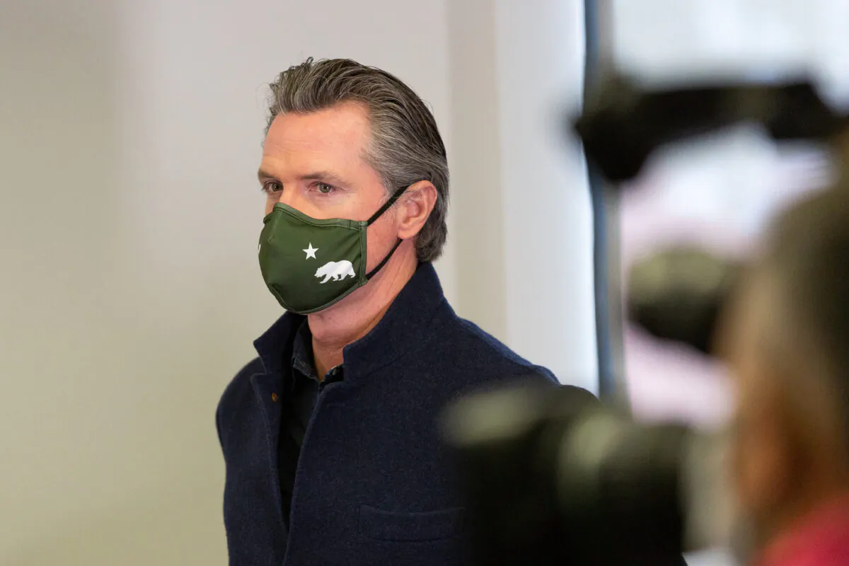 Gov. Gavin Newsom attends a press conference at AltaMed Urgent Care in Santa Ana, Calif., on March 25, 2021. (John Fredricks/The Epoch Times)