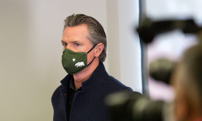 Gov. Gavin Newsom attends a press conference at AltaMed Urgent Care in Santa Ana, Calif., on March 25, 2021. (John Fredricks/The Epoch Times)