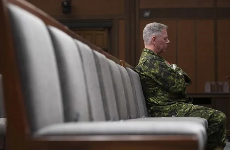 Chief of Defence Staff Jonathan Vance sits in the front row during a news conference, in Ottawa, on June 26, 2020. A civil servant who met with the former military ombudsman about sexual misconduct allegations against Canada's former top military commander is reiterating she did not have enough information to take further action. (Adrian Wyld/The Canadian Press)