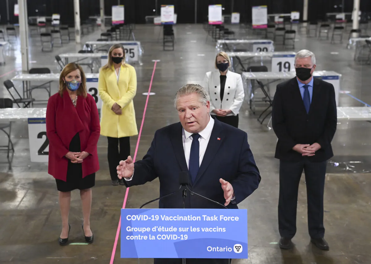 Ontario Premier Doug Ford answers questions from the media at a mass COVID-19 vaccination clinic in Toronto on March 10, 2021. (Nathan Denette/The Canadian Press)
