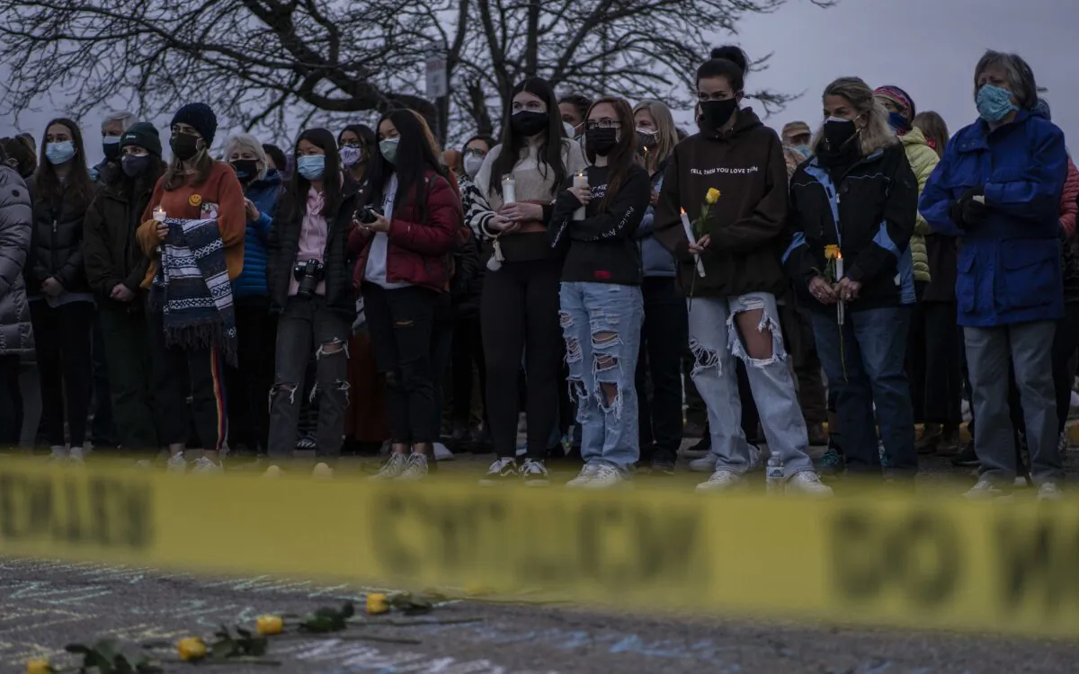 Mourners attend a vigil for the victims of a mass shooting at a King Soopers grocery store in Boulder, Colo., on March 25, 2021. The Monday shooting left ten people dead, including one police officer. (Chet Strange/Getty Images)