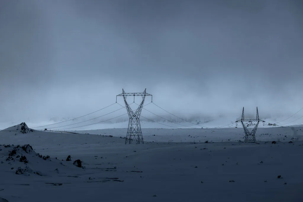 Power lines connected to the Snowy hydro electric scheme are seen running through Kosciuszko National Park as record snowfall impacts the region on August 23, 2020 in Kosciuszko National Park, Australia.  (Brook Mitchell/Getty Images)