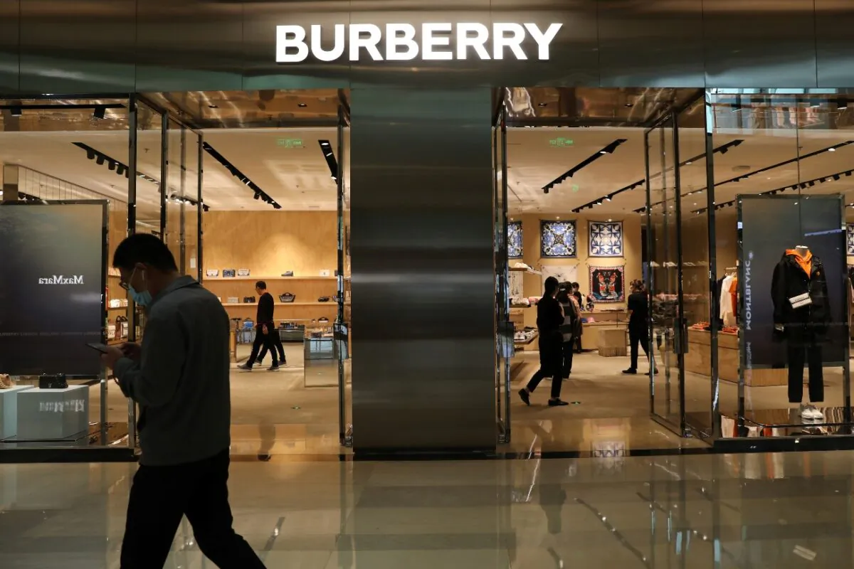 A man walks past a store of luxury brand Burberry at a shopping mall in Beijing, China, on March 26, 2021. (Tingshu Wang/Reuters)