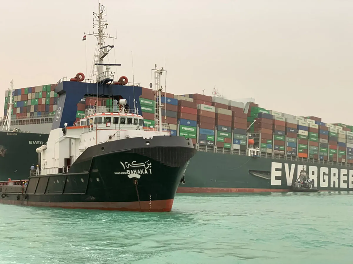 A part of the Taiwan-owned MV Ever Given (Evergreen), a 400-metre- (1,300-foot-) long and 59-metre wide vessel, lodged sideways and impeding all traffic across the waterway of Egypt's Suez Canal on March 24, 2021. (Suez Canal Authority/Handout/AFP via Getty Images)