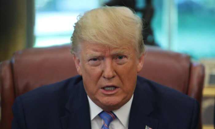 President Donald Trump speaks to the media after signing a bill for border funding in the Oval Office at the White House in Washington on July 1, 2019. (Mark Wilson/Getty Images)