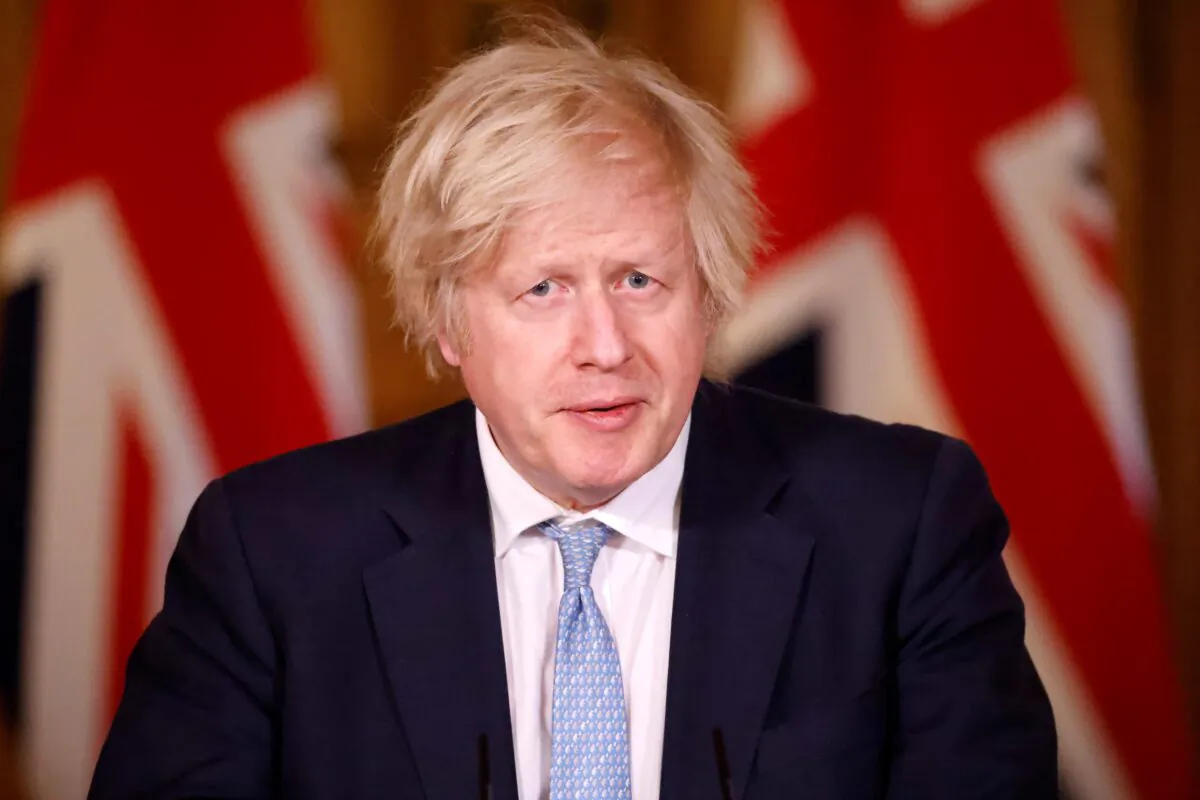 Prime Minister, Boris Johnson gives an update on the COVID-19 pandemic during a virtual press conference inside 10 Downing Street in London, England, on March 18, 2021. (Tolga Akmen/WPA Pool/Getty Images)
