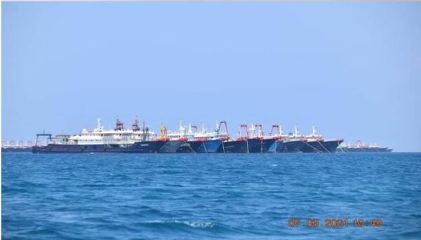 FILE PHOTO: Some of the about 220 vessels reported by the Philippine Coast Guard are pictured at Whitsun Reef, South China Sea